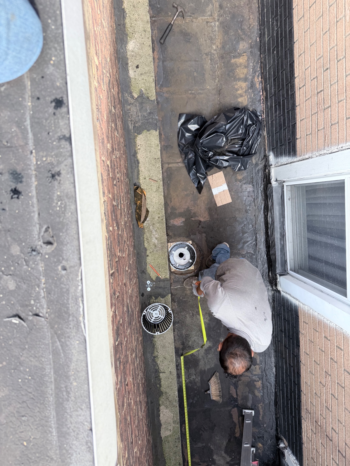 Measuring the flat roof section before installing material